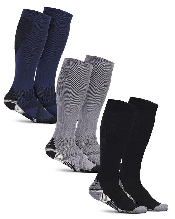 Set of three pairs of compression socks in navy, gray, and black on a white background