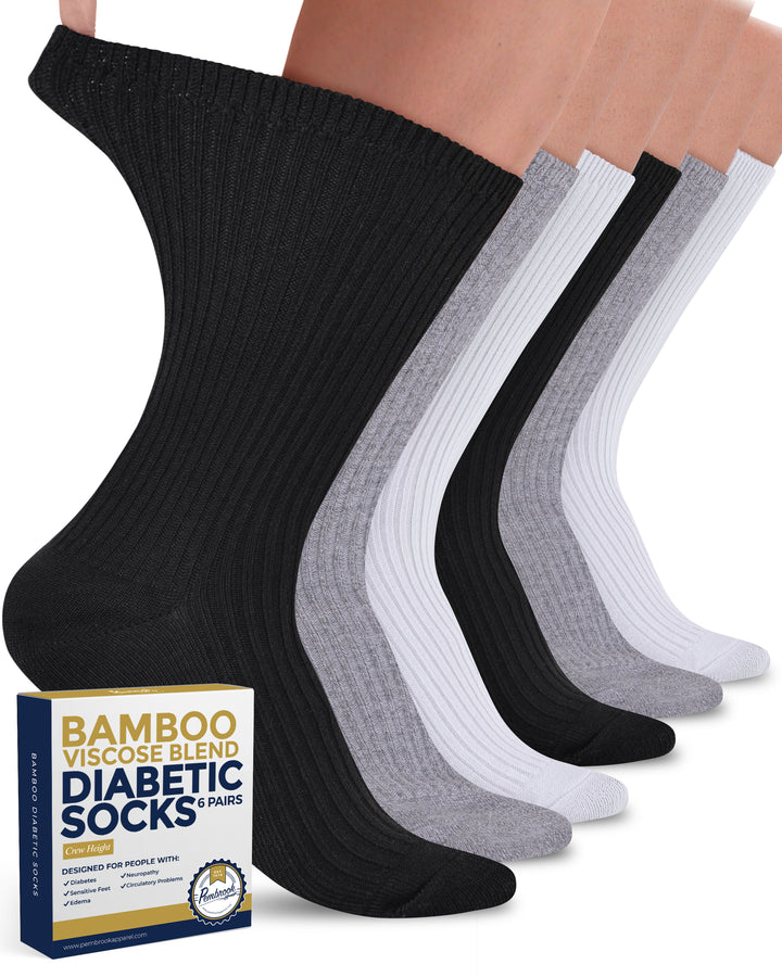 Set of black, gray, and white diabetic socks with a box labeled &