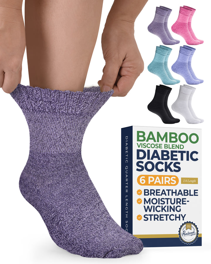 Purple diabetic sock being worn with a box of diabetic socks in the background