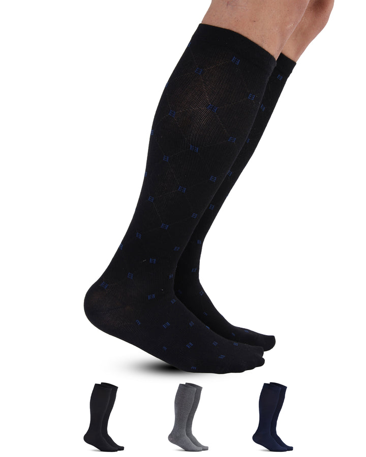 Black knee-high socks with blue pattern worn by a person, with additional pairs displayed below on a white background.