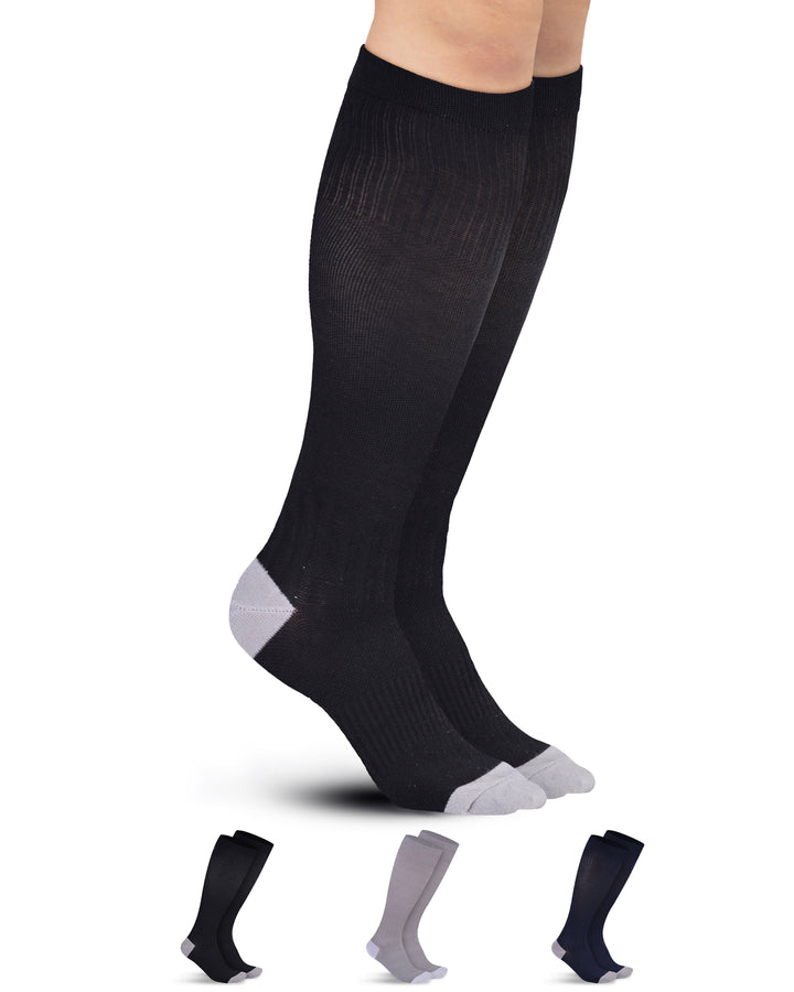 Black knee-high socks with gray toes and cuffs on a white background