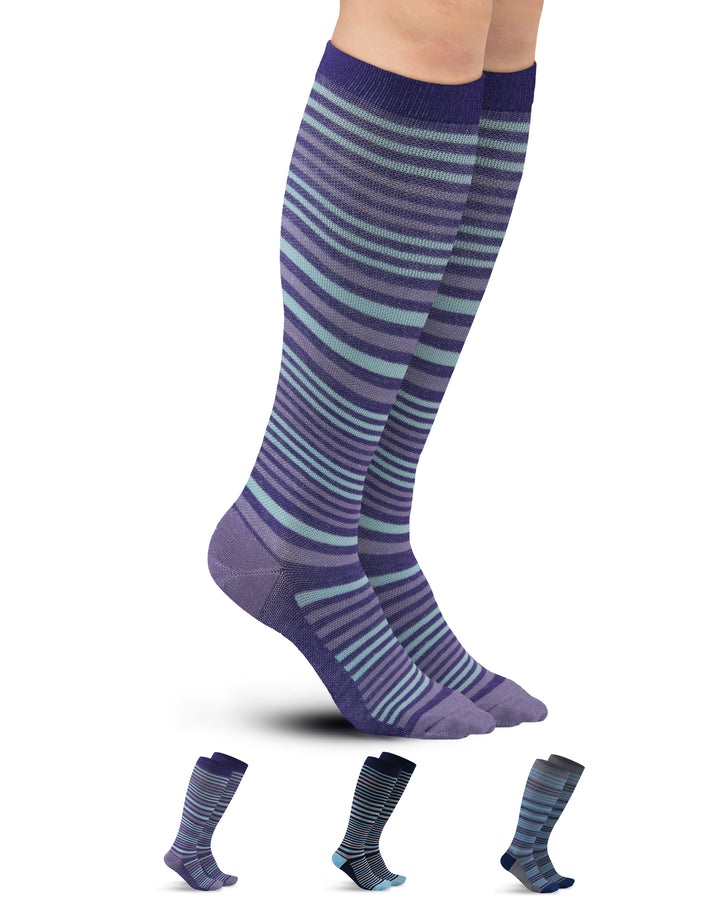 Purple and blue striped knee-high socks on a white background