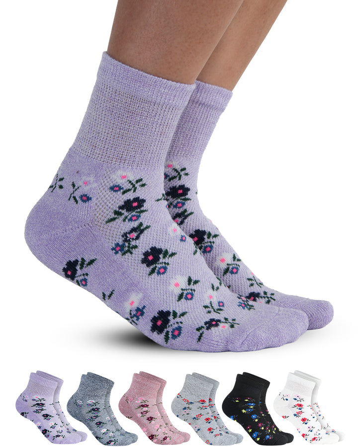Floral-patterned socks with a set of six additional pairs in various colors on a white background.