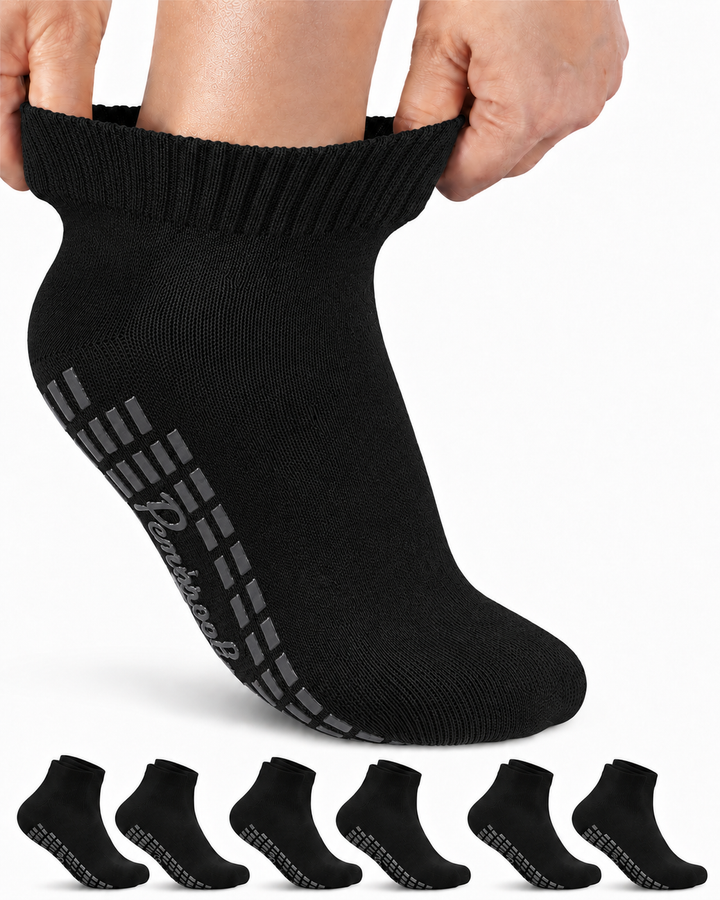 Person wearing a black ankle sock with striped pattern, with six additional socks displayed below on a white background.