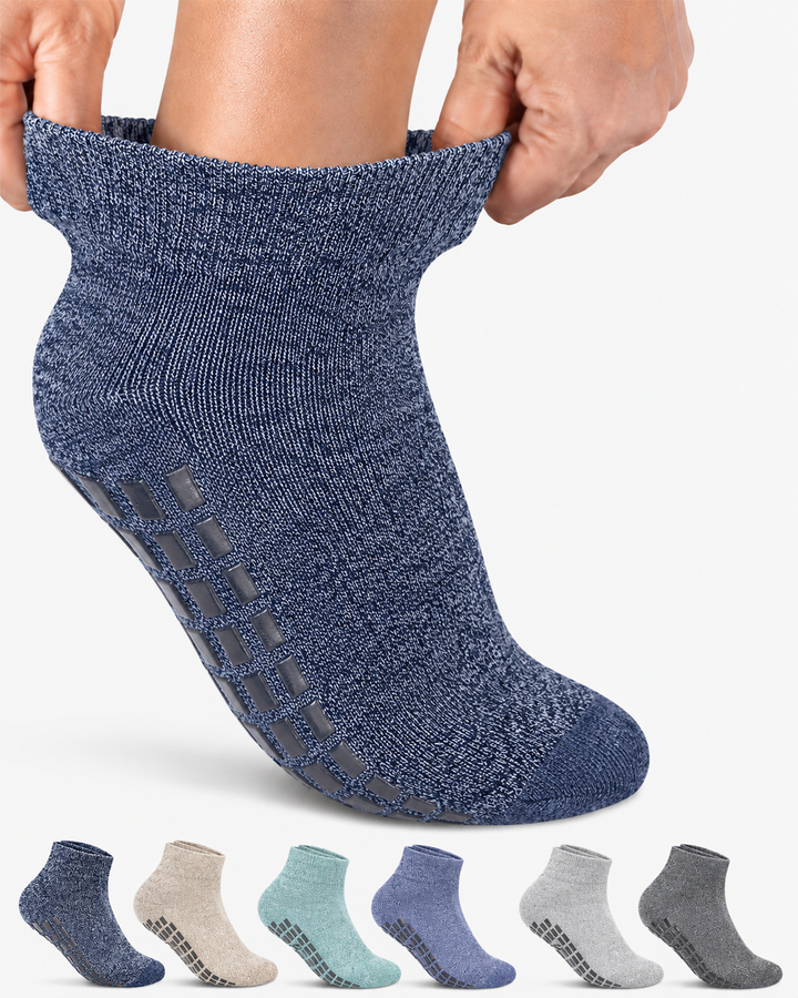 Blue ankle sock with sole pattern, shown on foot, with six other color options below.