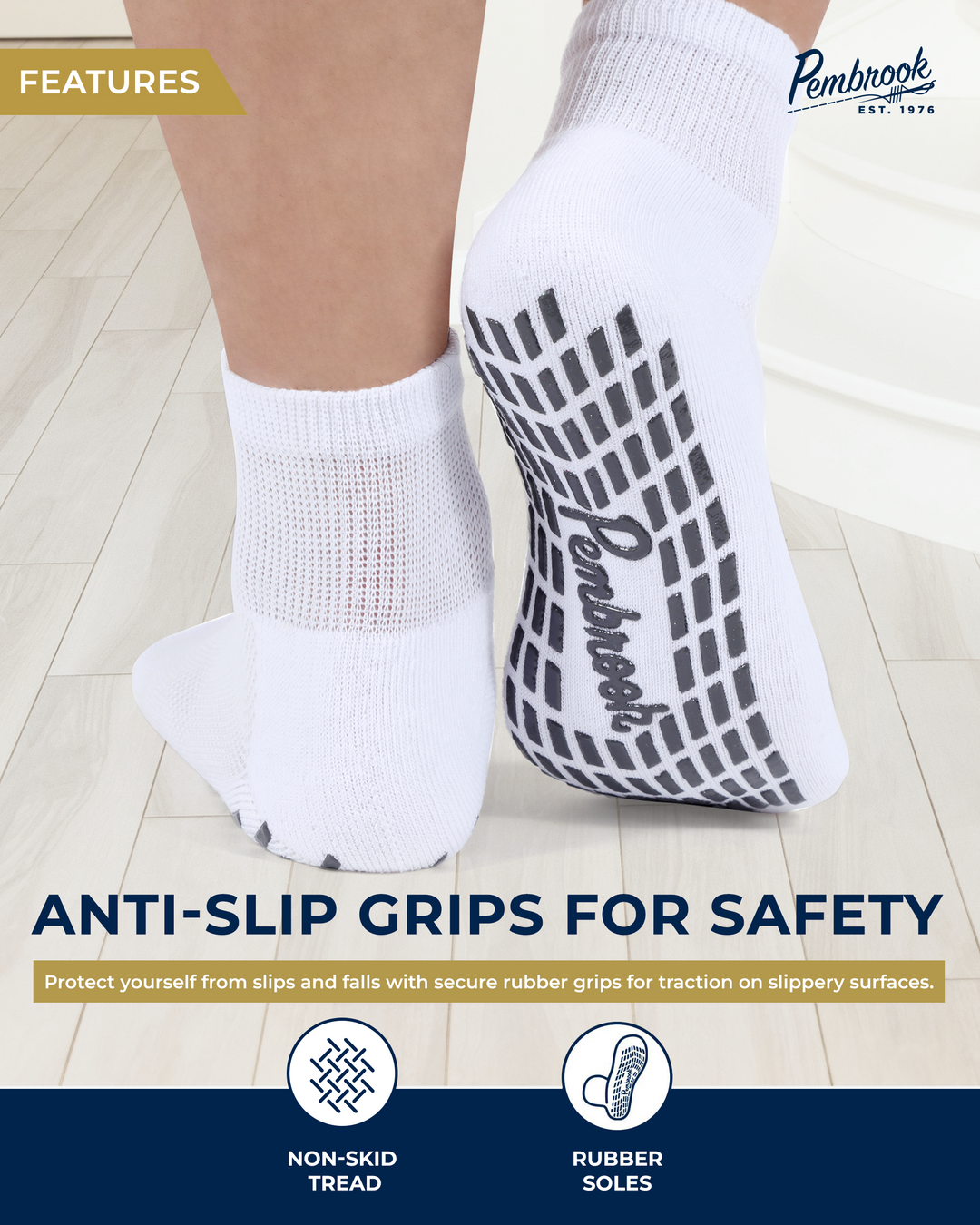 White socks with anti-slip grips on a light wooden floor, featuring the Pembrook brand.