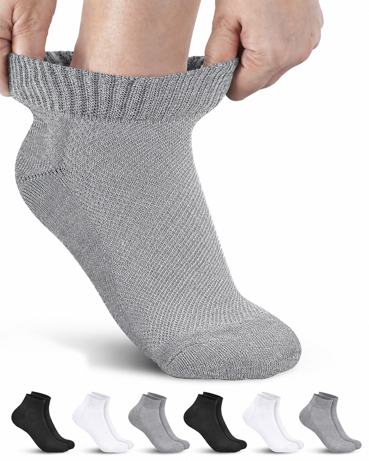 Gray ankle sock being held up with six pairs of black, white, and gray ankle socks displayed below on a white background.