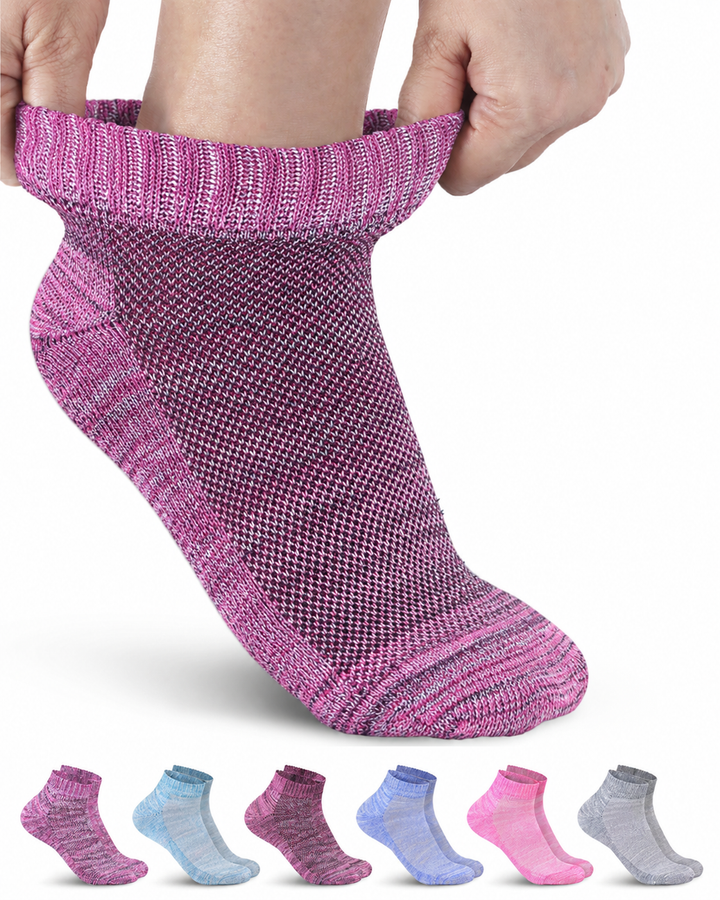 Person wearing a pink sock with a white background, showing a close-up of the sock.
