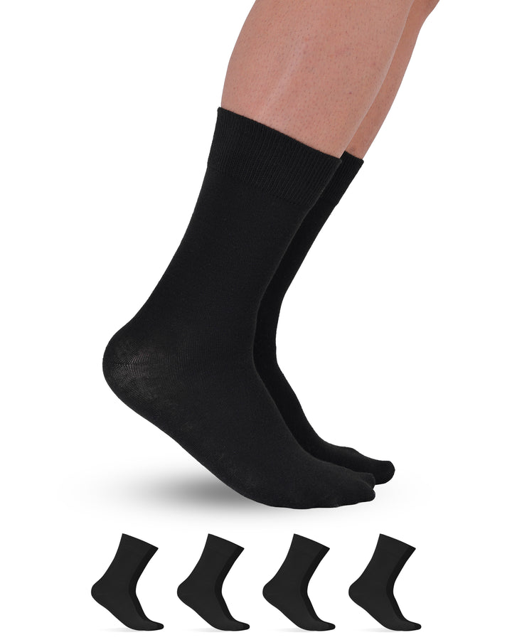 Black socks being worn with a set of six black socks displayed below on a white background.