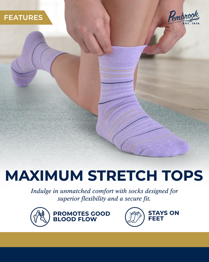 Person wearing purple socks with text about maximum stretch tops and brand logo.