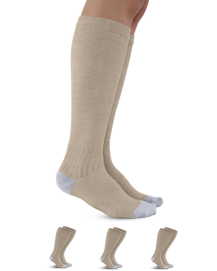 Beige knee-high socks with gray toes and cuffs on a white background