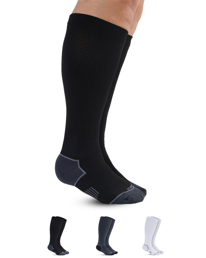 Black knee-high socks with additional pairs in gray and white on a white background