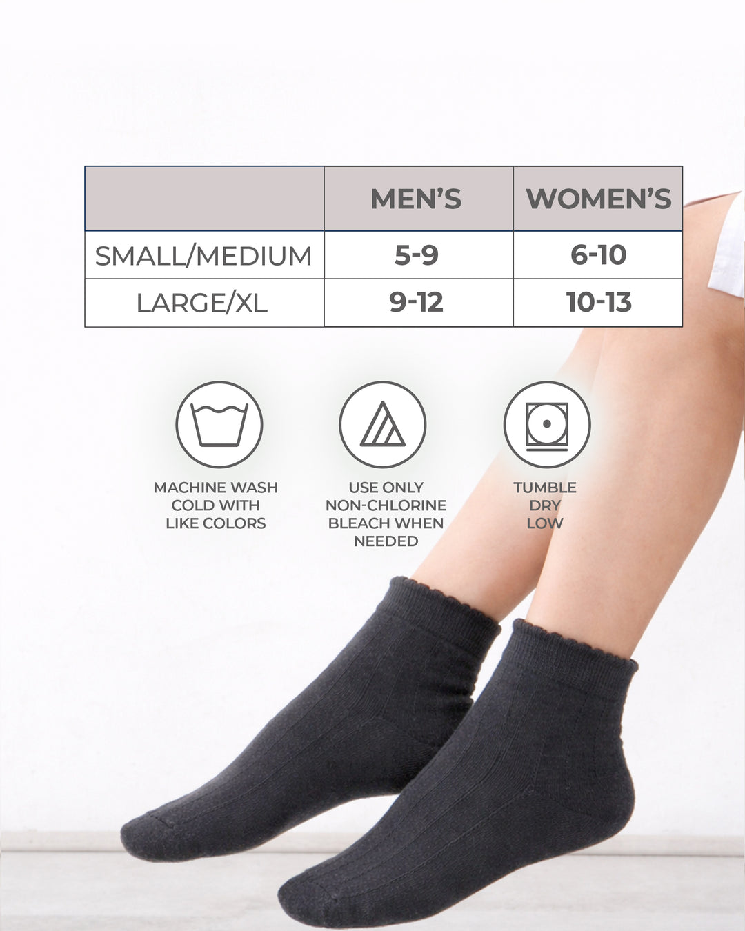 Black socks with size chart and care instructions on a white background