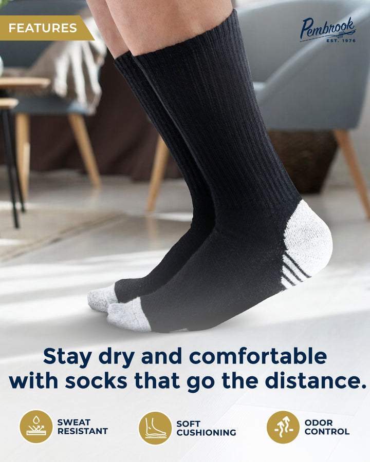 Person wearing black socks with white toes and heels indoors, featuring text and logos about sock features.